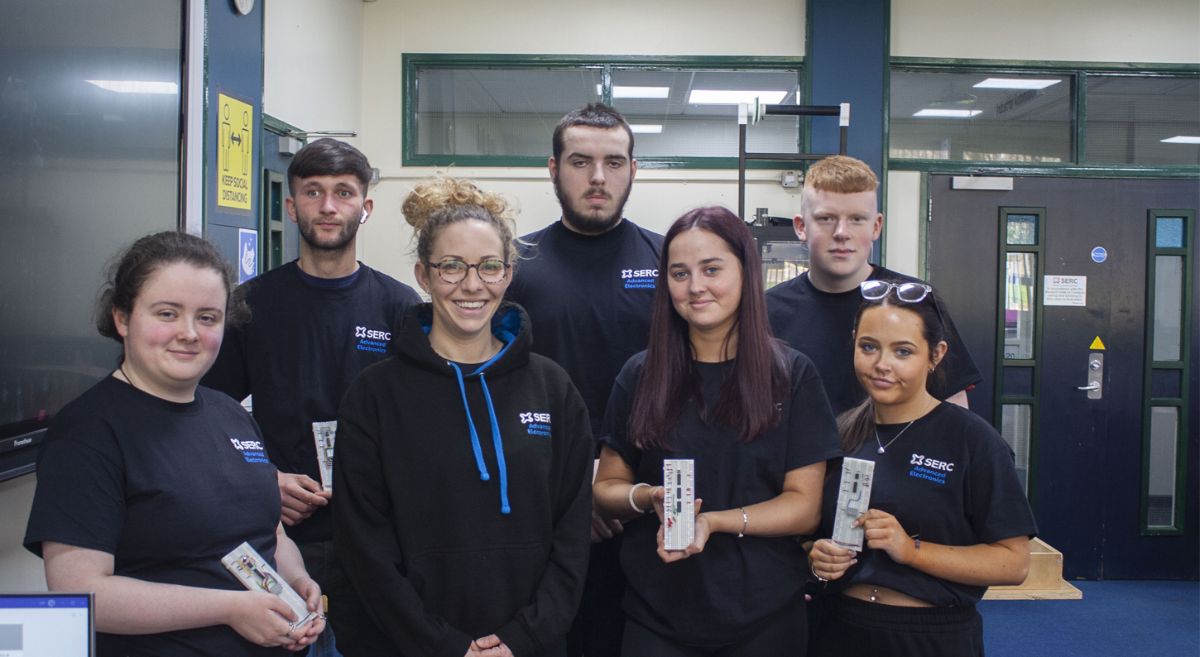 First year Bangor students from Level 3 National Extended Diploma Engineering - Advanced Electronics, holding circuits.